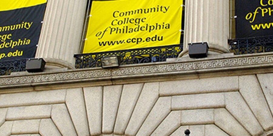 A banner hanging from the side of a building.