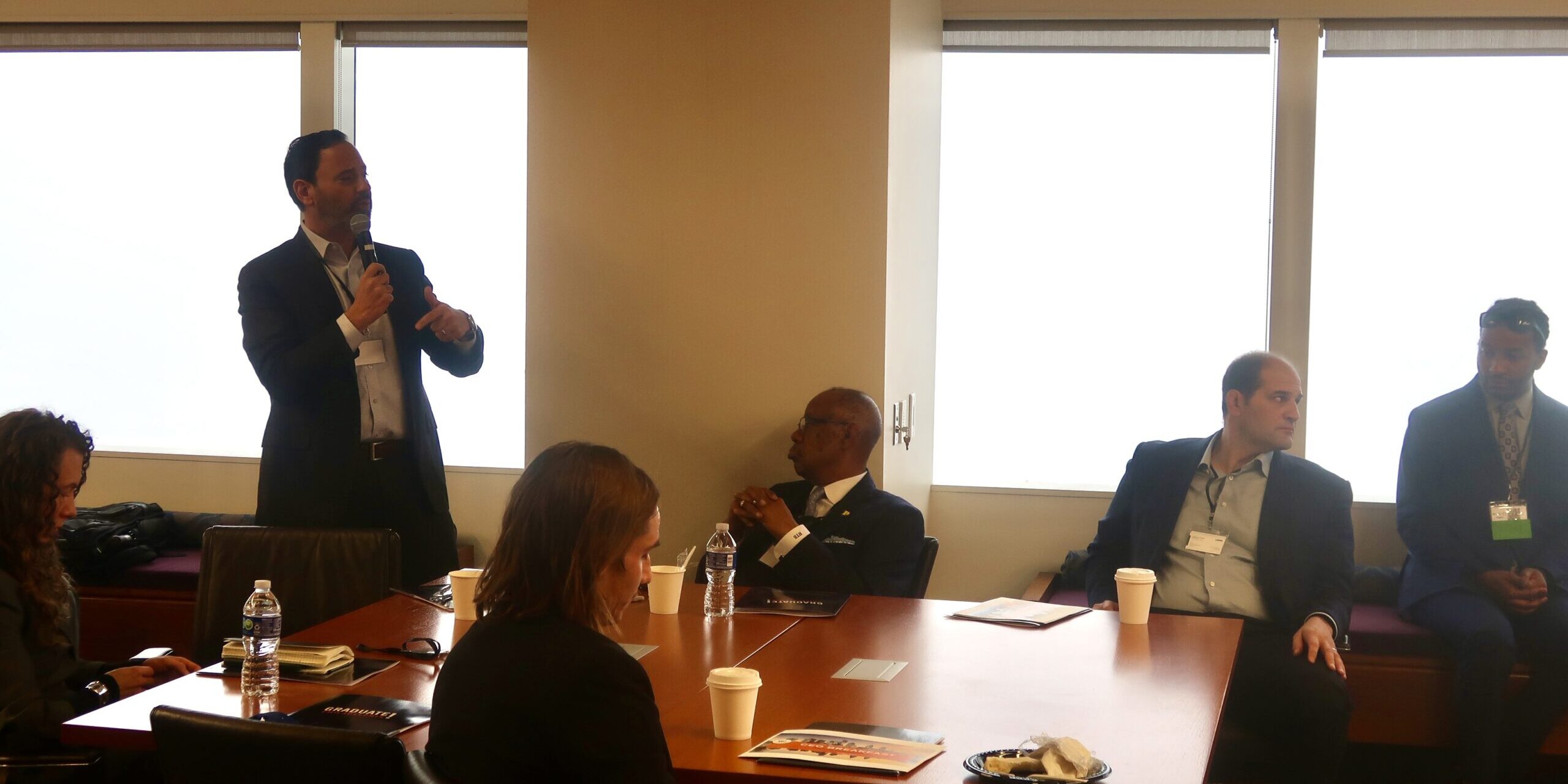 A group of people sitting around a table.